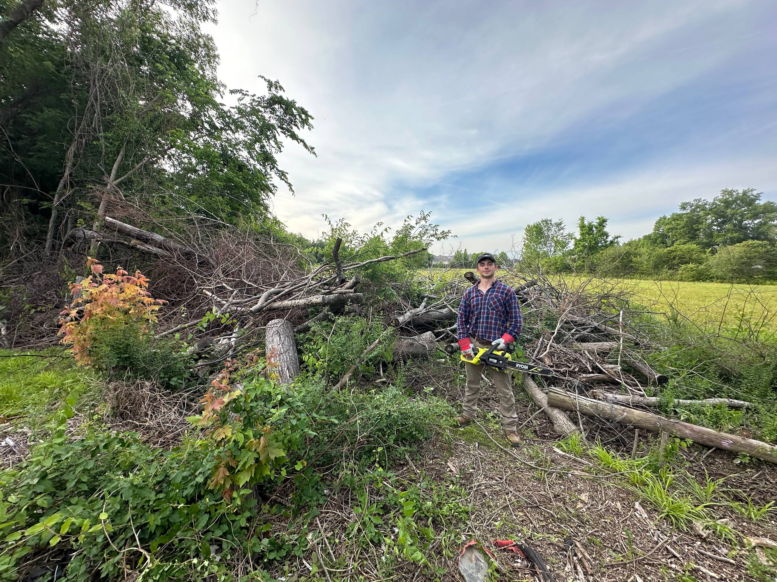 Crew clearing yard debris on site
